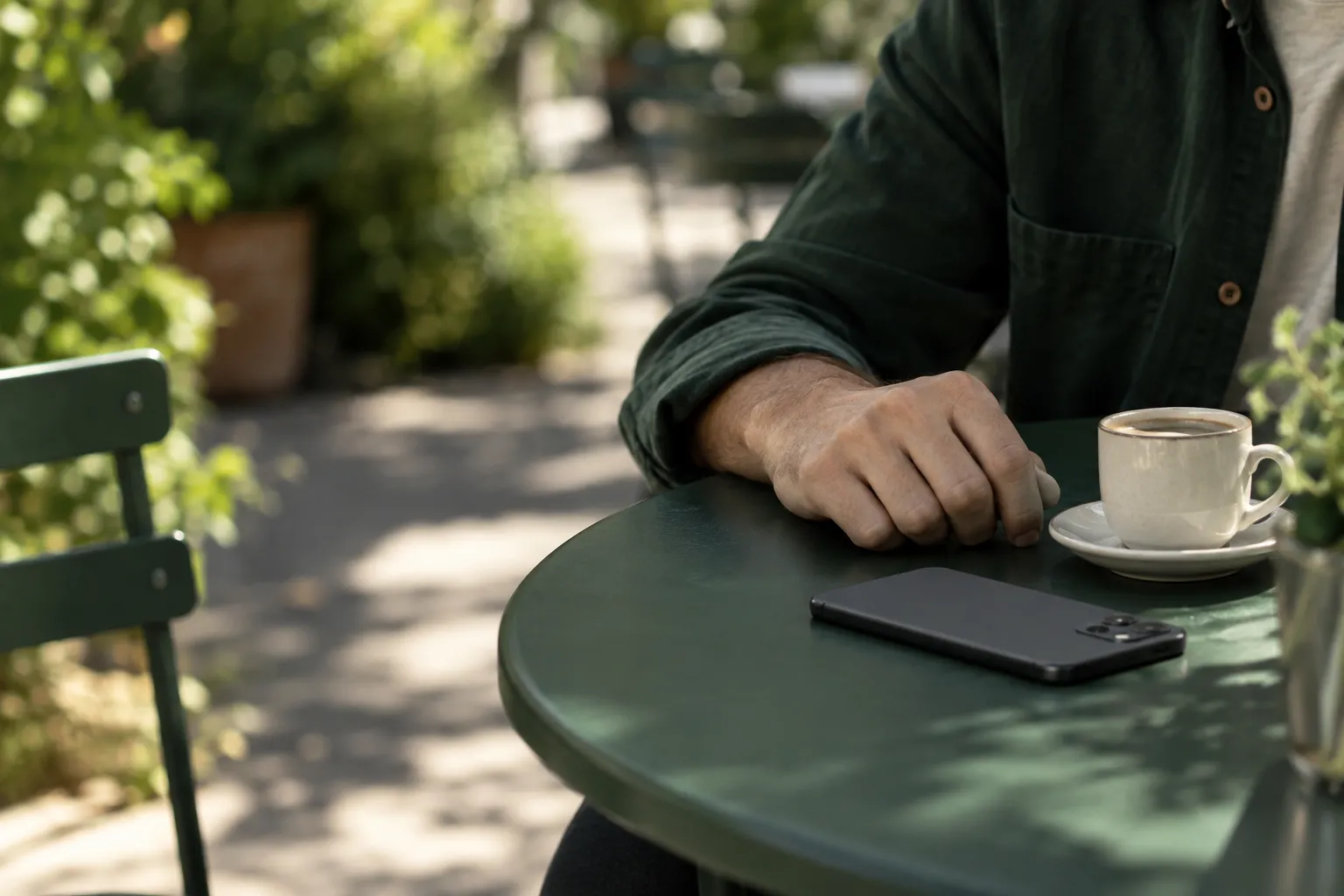 A quiet coffee outside, with a phone set face down.